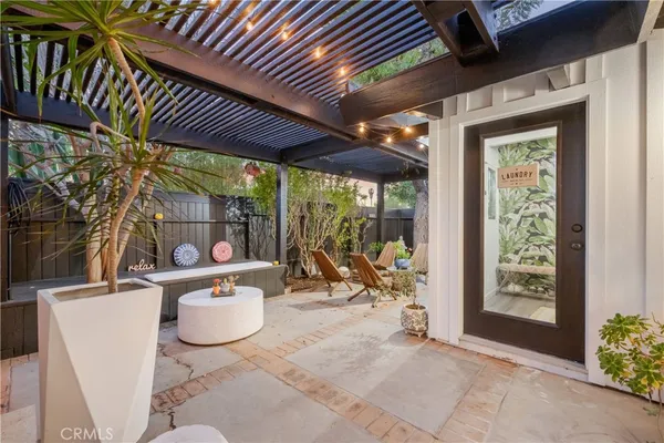 a view of an outdoor sitting area with furniture