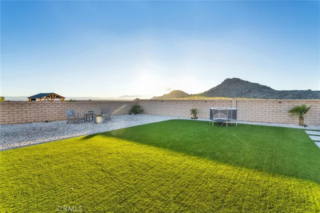 a view of a swimming pool with lounge chairs