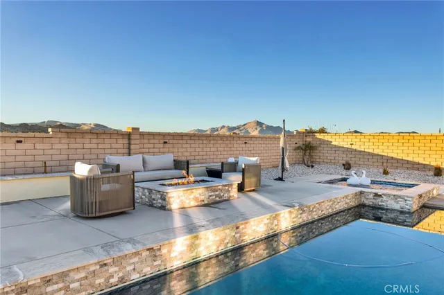 a kitchen with a stove a sink and a microwave