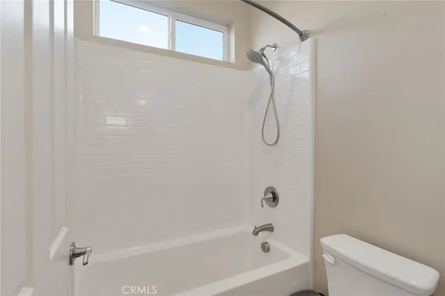 a view of a kitchen with appliances and cabinets