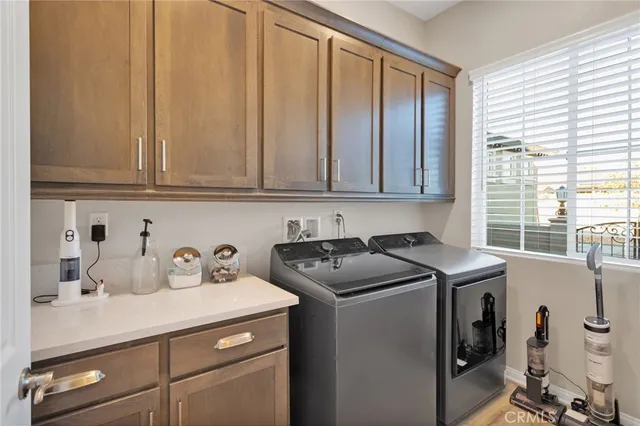 a kitchen with stainless steel appliances a stove a sink and cabinets