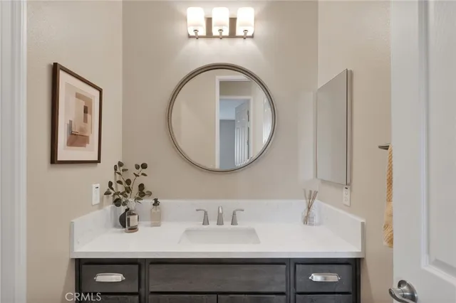 a dining room with fireplace and wooden floor