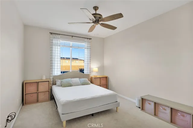 a kitchen with stainless steel appliances granite countertop a sink a stove a refrigerator and island with wooden floor