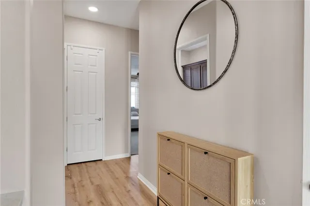 a spacious bathroom with a double vanity sink a large mirror and a bathtub
