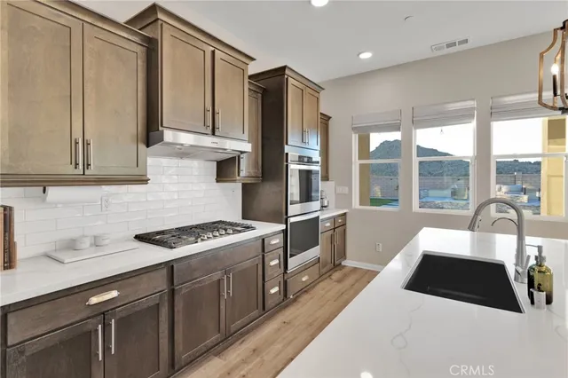 a bedroom with a bed and a lamp