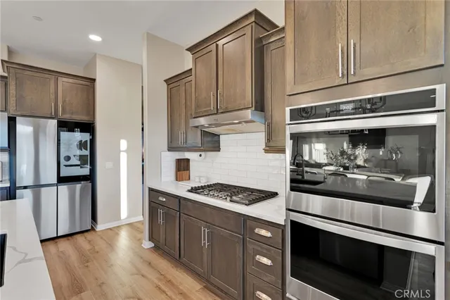 a spacious bedroom with a bed and a couch