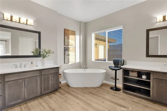 a living room with furniture a large window and a fireplace
