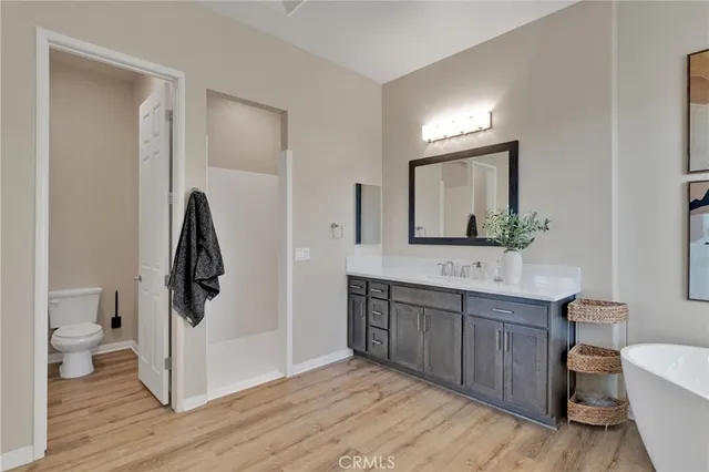 a kitchen with stainless steel appliances granite countertop a stove a microwave and a sink