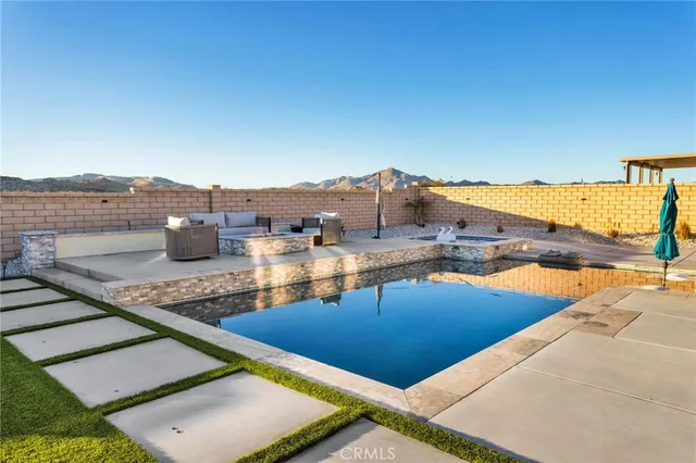 a view of a swimming pool with an ocean view