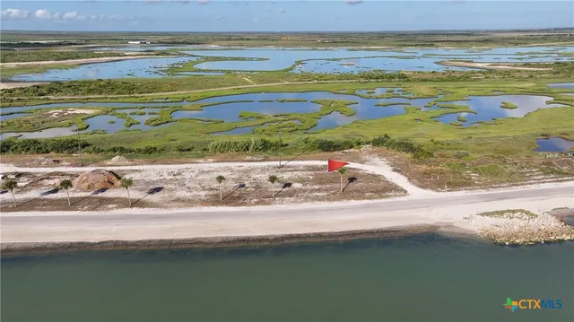 a view of a room with a sink and wooden floor