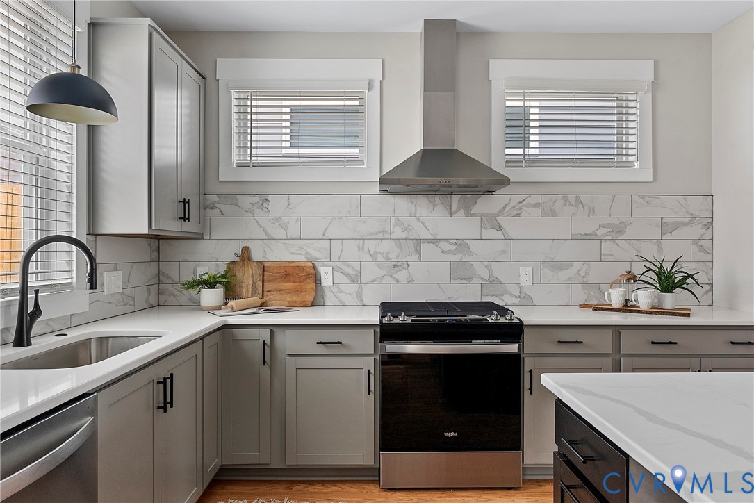 2909 R Street Richmond, VA 23223 - Photo 16 of 50 a kitchen with a sink stove and cabinets