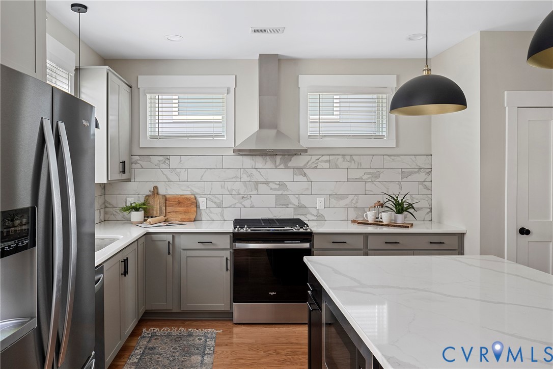 2909 R Street Richmond, VA 23223 - Photo 18 of 50 a kitchen with a sink a stove and refrigerator