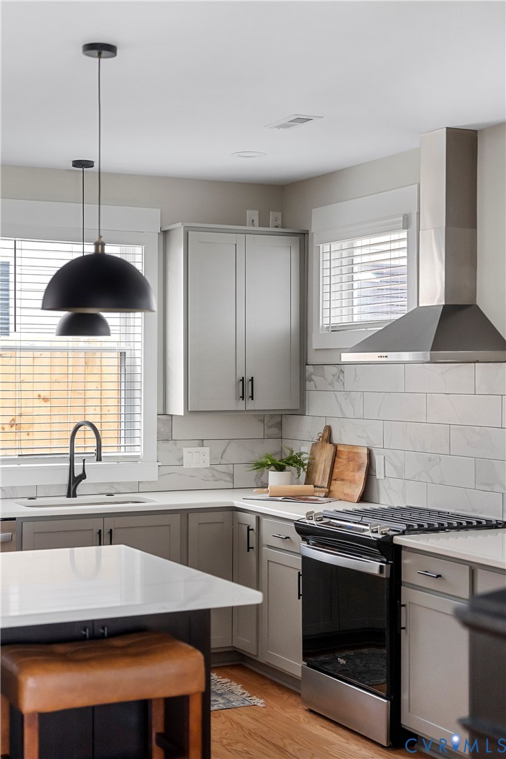 2909 R Street Richmond, VA 23223 - Photo 20 of 50 a kitchen with a sink cabinets and window