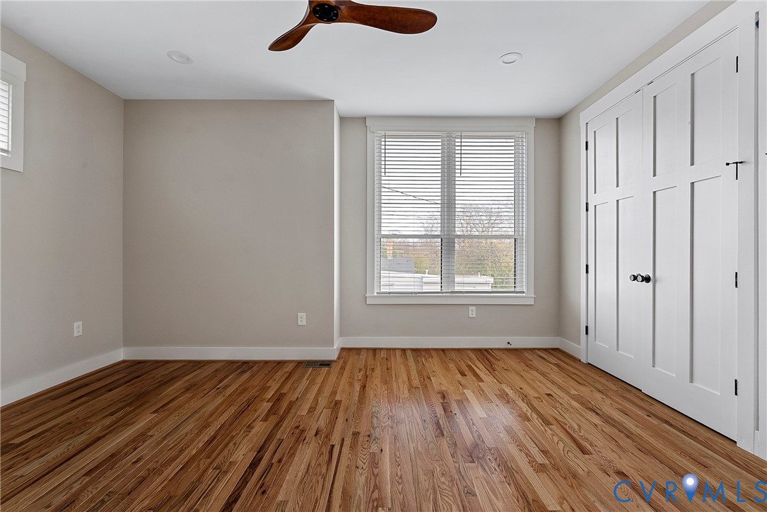 2909 R Street Richmond, VA 23223 - Photo 36 of 50 wooden floor in an empty room with a window