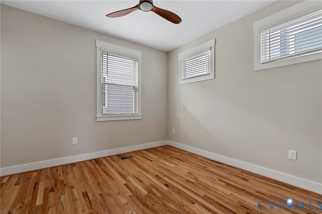 2909 R Street Richmond, VA 23223 - Photo 42 of 50 a view of an empty room with wooden floor and a window
