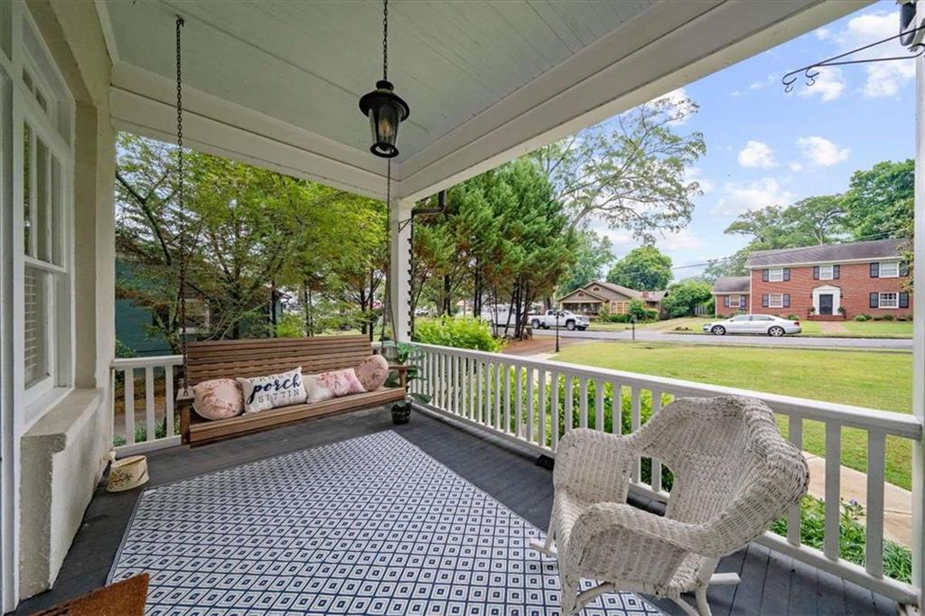 106 Westmore Road Southwest Rome, GA 30165 - Photo 55 of 56 a view of a porch with furniture and a yard