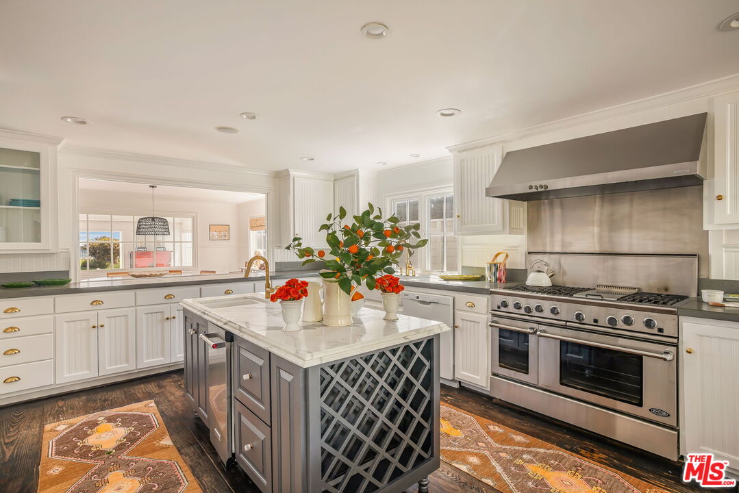 30810 Broad Beach Road Malibu, CA 90265 - Photo 17 of 43 a kitchen with a sink stove and cabinets