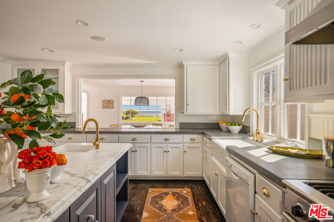 30810 Broad Beach Road Malibu, CA 90265 - Photo 18 of 43 a kitchen with stainless steel appliances granite countertop a sink stove and cabinets