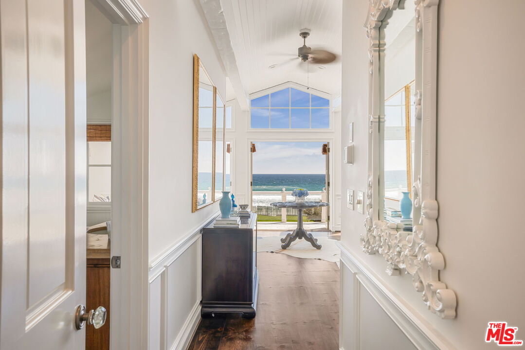 30810 Broad Beach Road Malibu, CA 90265 - Photo 23 of 43 a living room with furniture and large windows