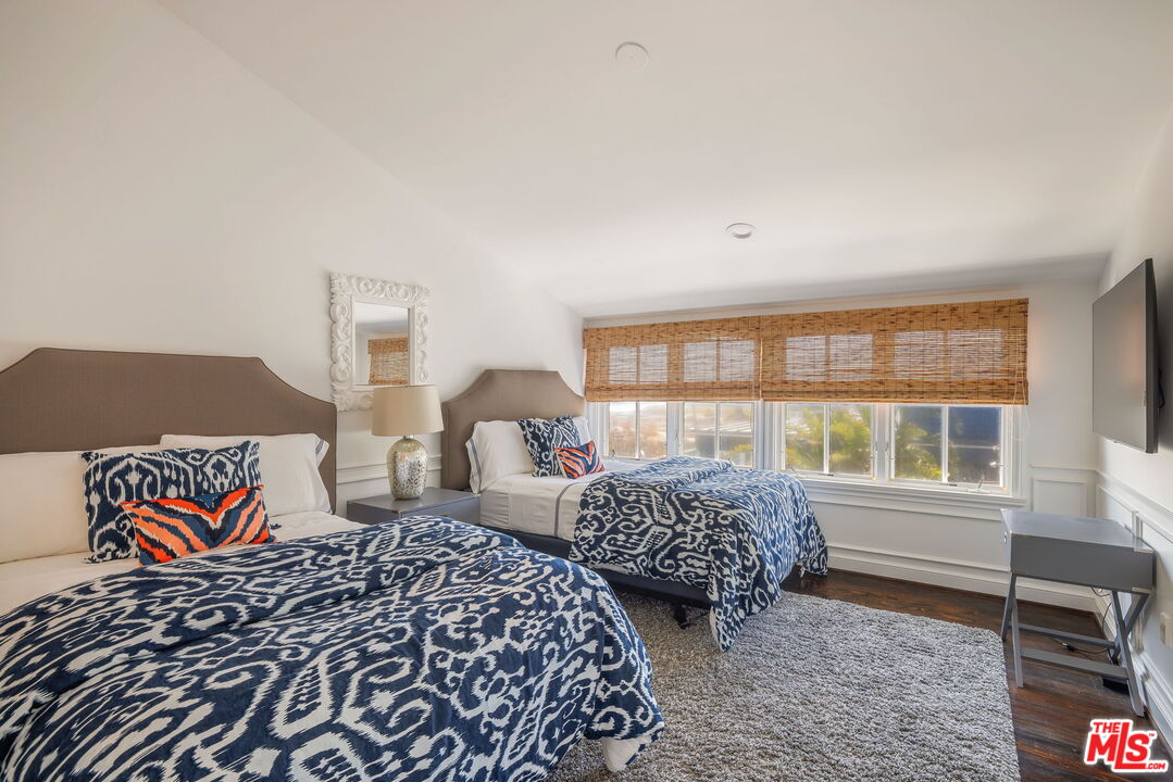 30810 Broad Beach Road Malibu, CA 90265 - Photo 29 of 43 a bedroom with two beds and a window