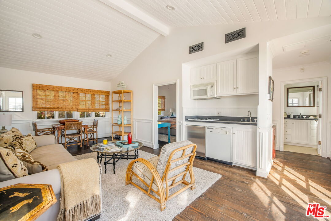 30810 Broad Beach Road Malibu, CA 90265 - Photo 38 of 43 a living room with furniture white walls and kitchen view