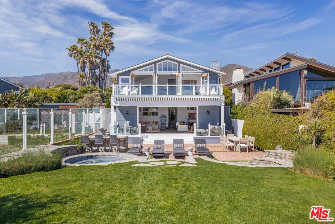 30810 Broad Beach Road Malibu, CA 90265 - Photo 4 of 43 a front view of house with a garden and swimming pool