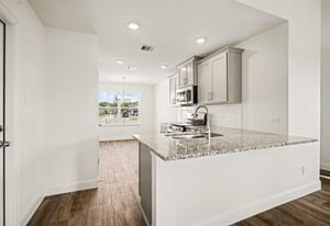 19 Greenbriar Loop Angleton, TX 77515 - Photo 13 of 19 Spacious kitchen and dining room combo featuring beautiful granite countertops, ideal for cooking, entertaining, and family gatherings.