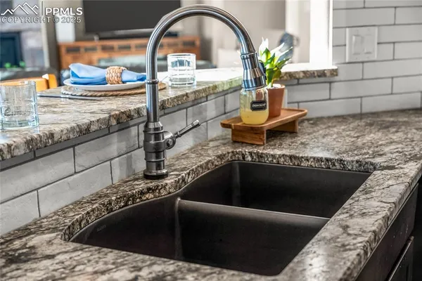 a view of a kitchen island with a sink