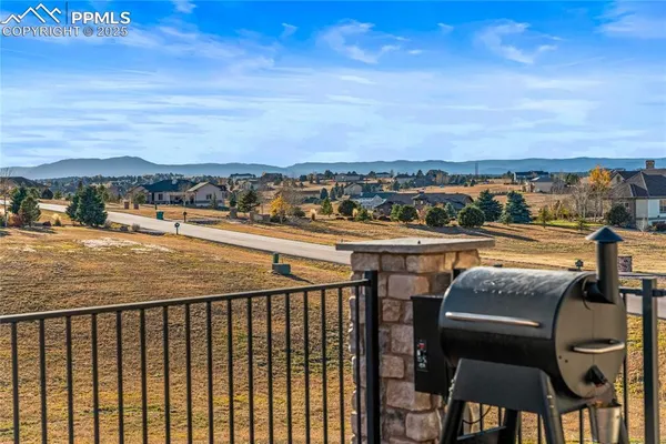 a view of a balcony with an outdoor seating