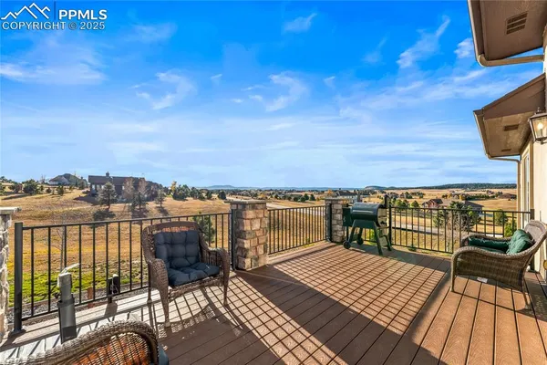 a view of a balcony with wooden floor