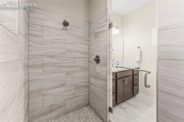 a bathroom with a shower and a sink