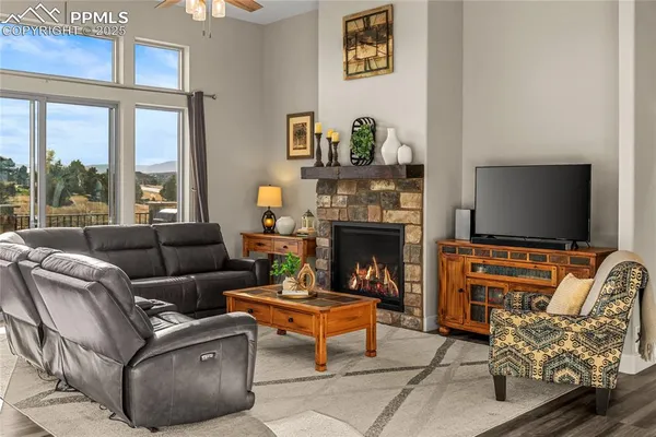 a living room with furniture fireplace and a flat screen tv