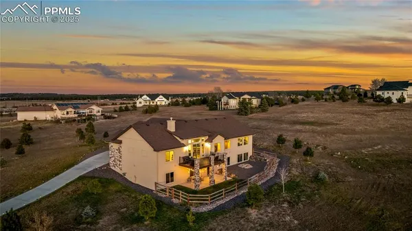 an aerial view of a house with a garden