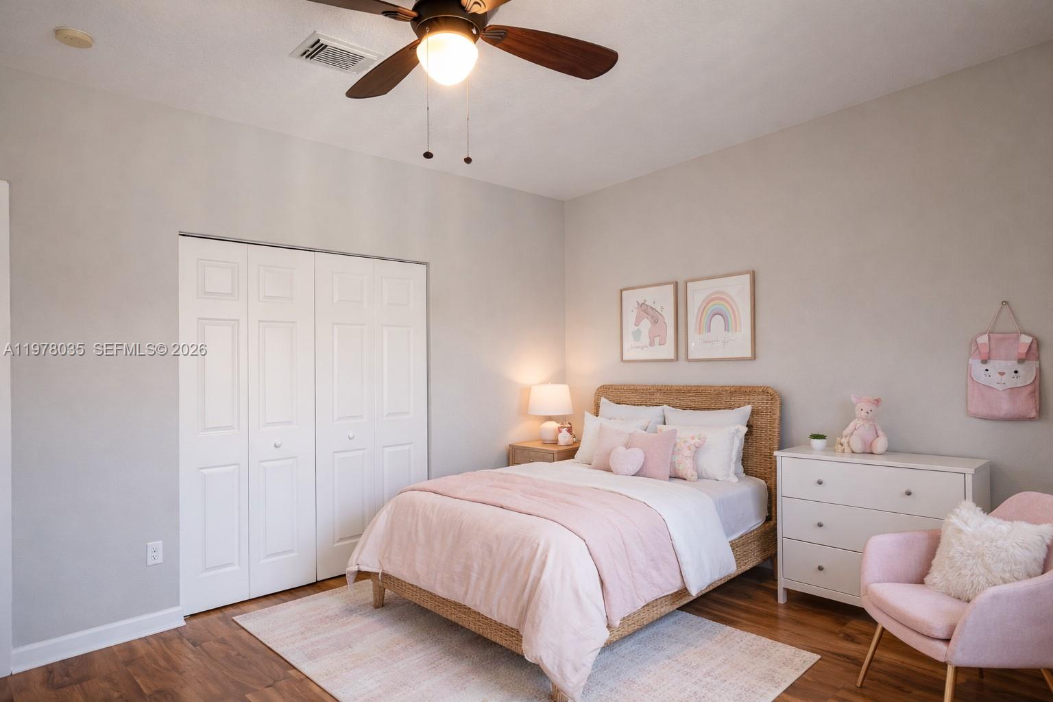11243 Southwest 230th Terrace Miami, FL 33170 - Photo 13 of 22 a bedroom with a bed and a chandelier