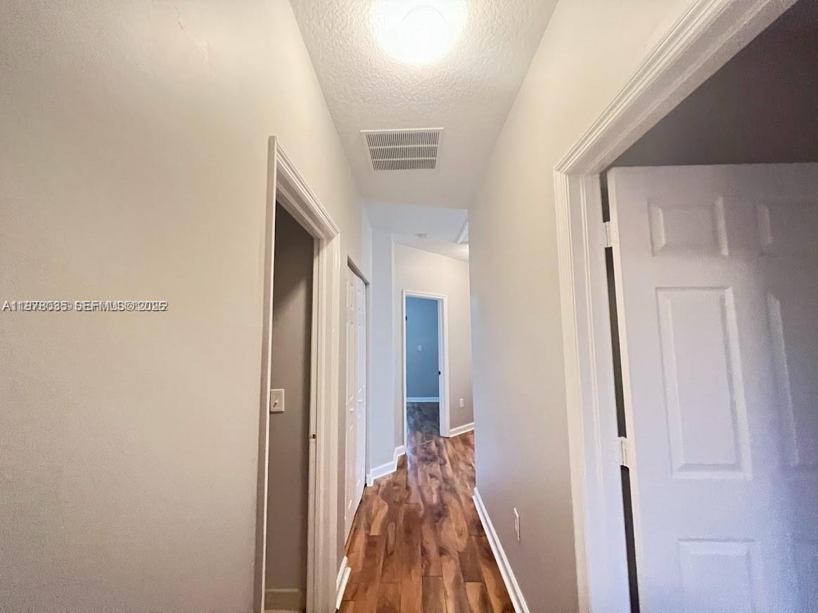 11243 Southwest 230th Terrace Miami, FL 33170 - Photo 19 of 22 a view of a livingroom from a hallway