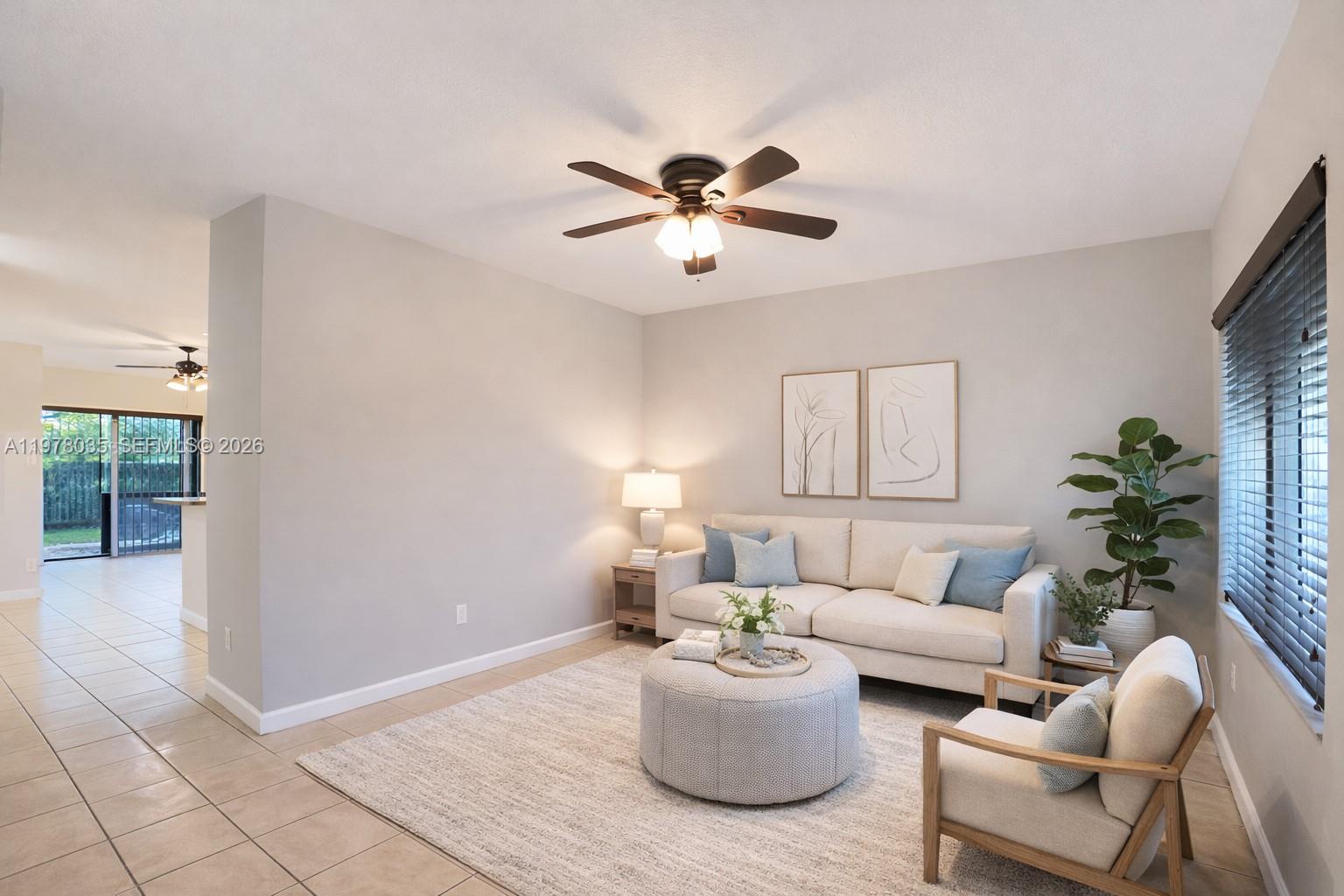 11243 Southwest 230th Terrace Miami, FL 33170 - Photo 4 of 22 a living room with furniture and a chandelier