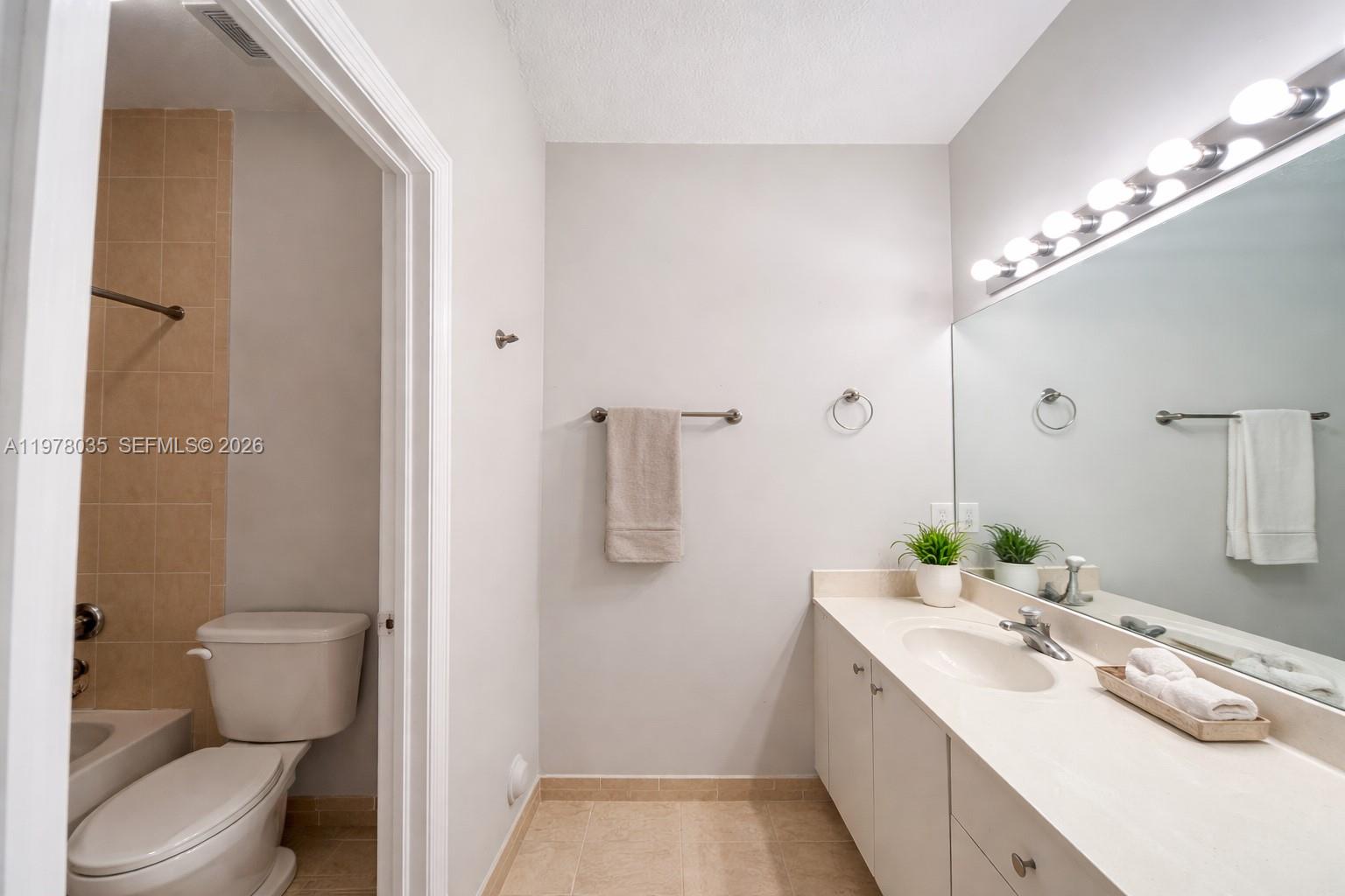 11243 Southwest 230th Terrace Miami, FL 33170 - Photo 7 of 22 a bathroom with a sink a toilet and shower