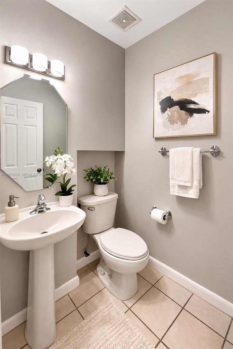 11243 Southwest 230th Terrace Miami, FL 33170 - Photo 10 of 22 a bathroom with a toilet sink and mirror