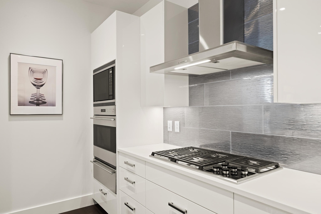 50 Liberty Drive, Unit 11L Boston, MA 02210 - Photo 12 of 40 a stove top oven sitting inside of a kitchen