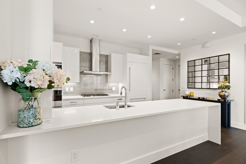 50 Liberty Drive, Unit 11L Boston, MA 02210 - Photo 16 of 40 a bathroom with a double vanity sink mirror and flower