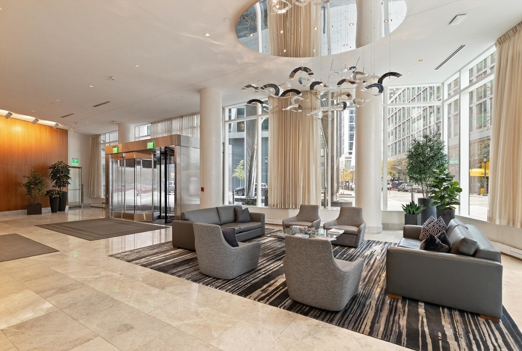 50 Liberty Drive, Unit 11L Boston, MA 02210 - Photo 35 of 40 a living room with furniture and a large window