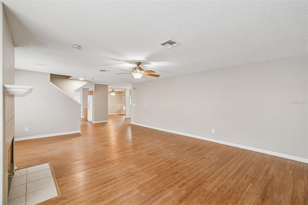1854 Ridge Valley Street Clermont, FL 34711 - Photo 14 of 73 wooden floor in an empty room with a window