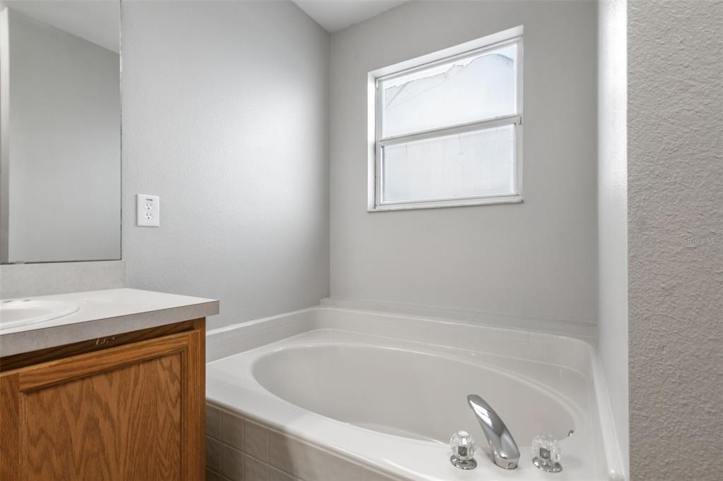 1854 Ridge Valley Street Clermont, FL 34711 - Photo 34 of 73 a bathroom with a bathtub