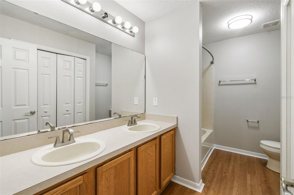 1854 Ridge Valley Street Clermont, FL 34711 - Photo 38 of 73 a bathroom with a sink and a mirror