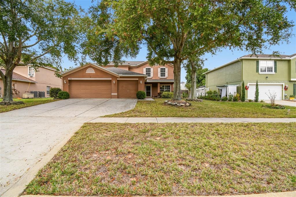1854 Ridge Valley Street Clermont, FL 34711 - Photo 4 of 73 a front view of a house with a yard