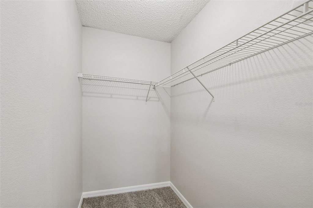 1854 Ridge Valley Street Clermont, FL 34711 - Photo 43 of 73 a view of a room with racks on the wall
