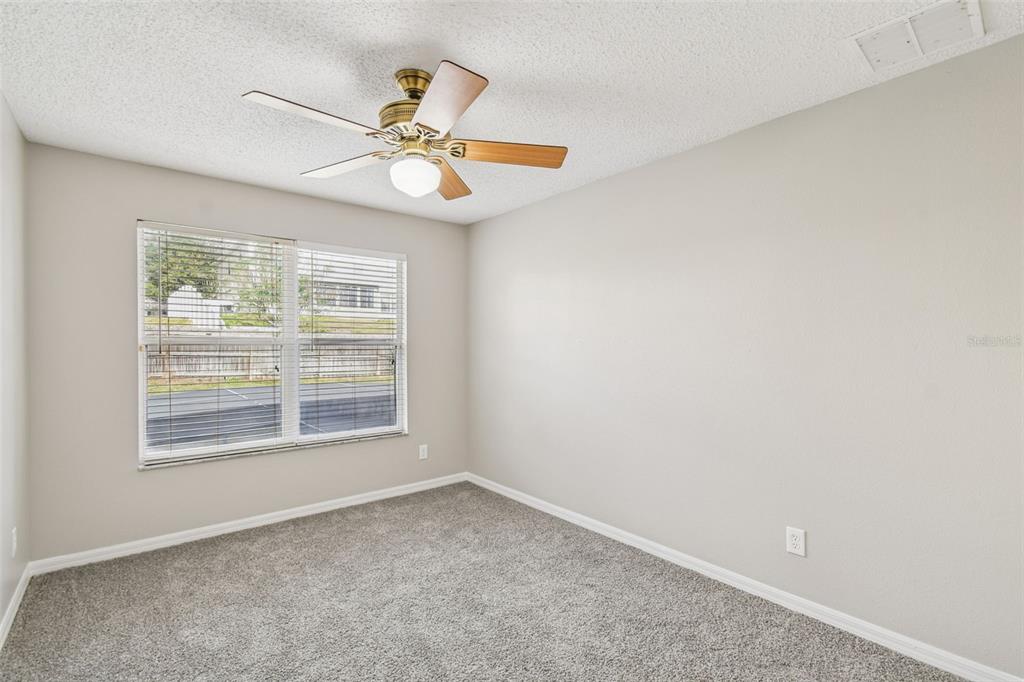 1854 Ridge Valley Street Clermont, FL 34711 - Photo 47 of 73 an empty room with a window and a fan