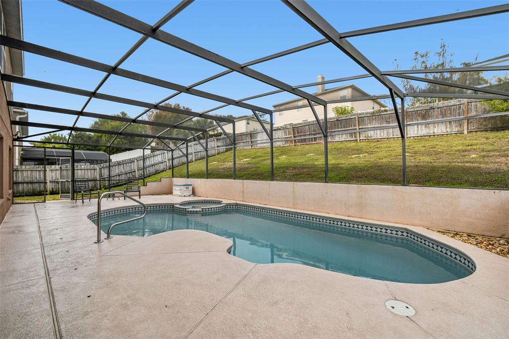 1854 Ridge Valley Street Clermont, FL 34711 - Photo 50 of 73 a view of a swimming pool with a patio
