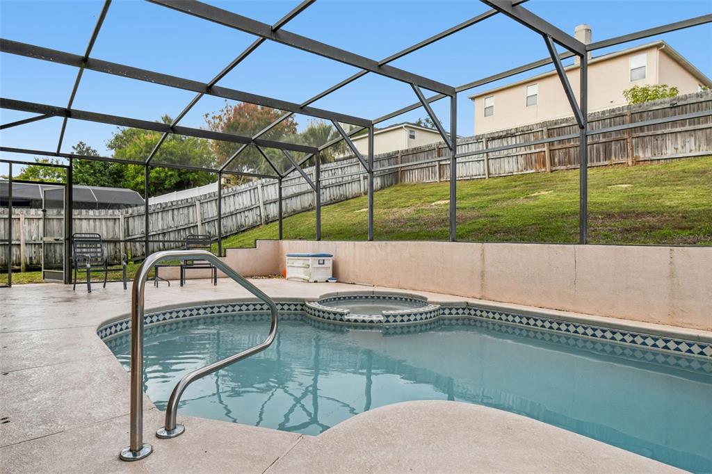 1854 Ridge Valley Street Clermont, FL 34711 - Photo 51 of 73 a view of a swimming pool with a patio