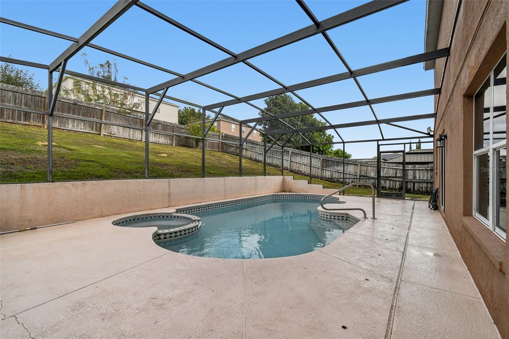 1854 Ridge Valley Street Clermont, FL 34711 - Photo 52 of 73 a view of a swimming pool with a porch